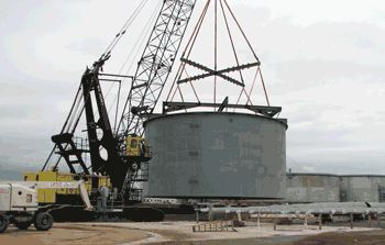 Holly Marine tug and barge is being loaded at Advance Boiler and Tank's Port of Milwaukee dock with 3 of 5 manufactured cycinders for the Oak Creek Power Plant Expansion.