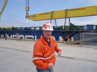 Federal Marine Terminals superintendant "Luke" illustrates how strong the cranes need to be to lift this monster of cargo, 