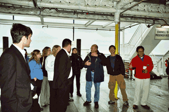 On a very blustery day, these students toured the Lake Express High Speed ferry. Captain Chris is describing the car deck of the vessel. Hey are you guys paying attention there on the left? Photo by Chris Schrage, UNI