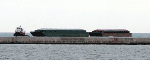 Rake barges coming through the Milwaukee breakwater.